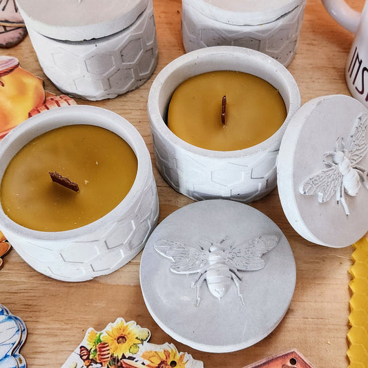 Beeswax candle in cement holder
